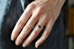 Wearing the Sapphire Pear cut ring with Halo by Elizabeth Street Jewelry