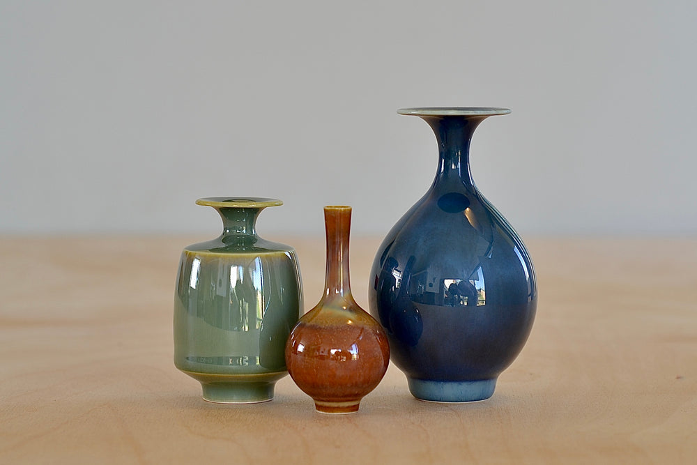 
            
                Load image into Gallery viewer, Miniature Hand Thrown Ceramic Vase Trio in Blue, Green and Brown by Yuta Segawa on white background.
            
        