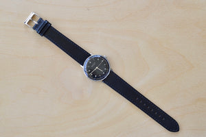 
            
                Load image into Gallery viewer, Full image of Max Bill 34mm Hand wound Watch Black Dial with Numbers designed for Junghans in 1961 and virtually unchanged. 34mm hand wound watch with black face and numbers with hand winding movement J805.1 (ETA 2801-2) and a sapphire crystal,  42 Hour Power Reserve in 316L stainless steel case available at OK..
            
        