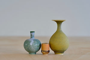 Miniature Hand Thrown Ceramic Vase Trio in Green Purple, Ochre and orange on white background by Yuta Segawa.