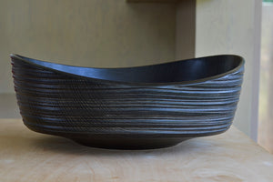 Front view of Circle Factory turned wood bowl in Black Oak with ridged grooves detailing by George Peterson. Made from reclaimed wood in North Carolina. 
