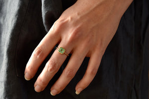 Wearing the simple emerald band ring by Elizabeth Street 23A , a 1.35 CT Columbian emerald in a 14k bezel and band.