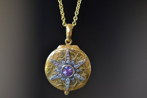 Close up of Arman Sarkyssian Oxidized Silver Star Locket with purple sapphire center stone and Diamond accent Pendant necklace in 22k Yellow Gold. 