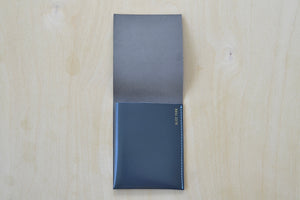 
            
                Load image into Gallery viewer, Inside of dark Gray Alice Park simple flap wallet with blue stitching.
            
        