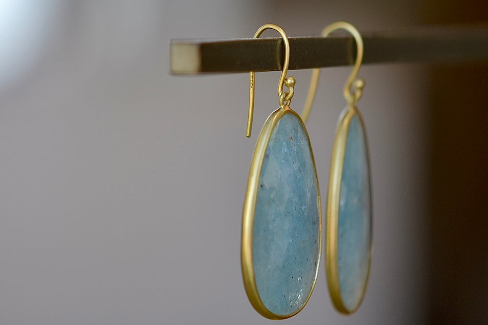 Side view of XL Aquamarine Egg Earrings designed by Tej Kothari. 