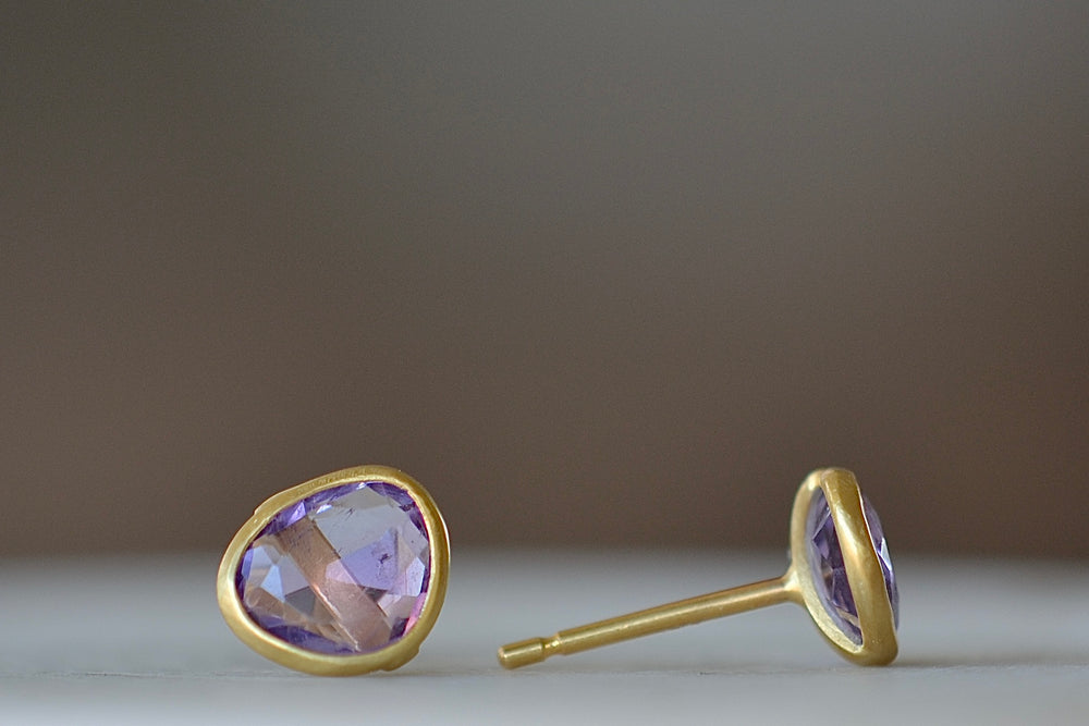 Side veiw of A new and smaller version of Pippa Small Classic Stud studs earrings in amethyst and 18k yellow gold.