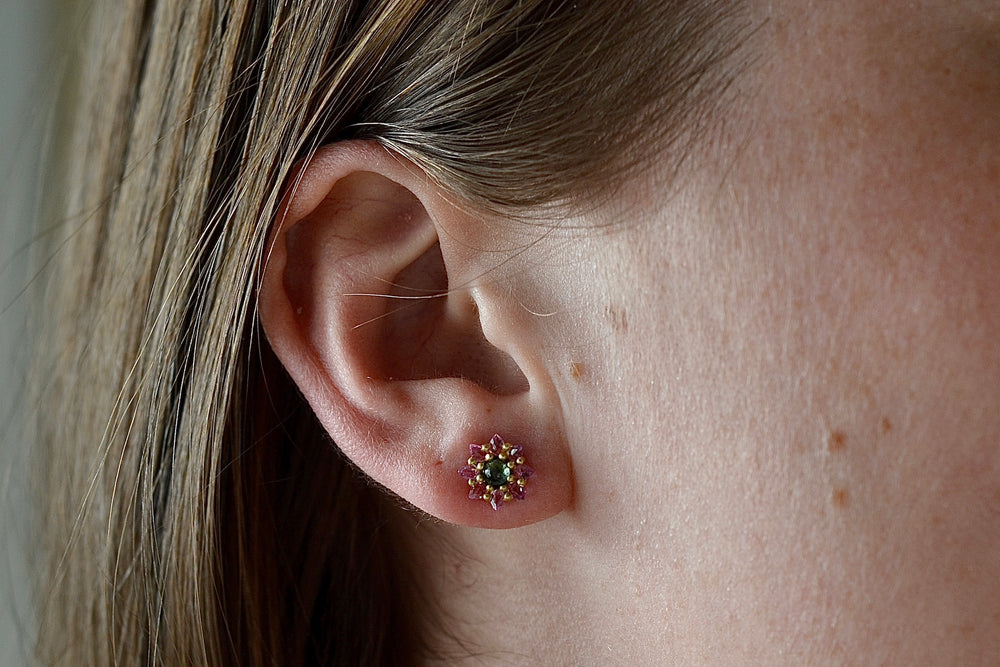 Wearing a Daisy stud by Polly Wales.