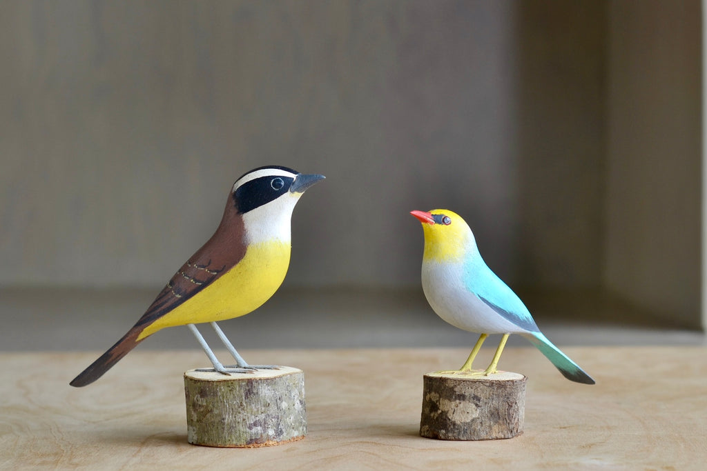 Selection of wooden and hand carved birds from Brazil, showing Great Kiskadee and Red Beak.