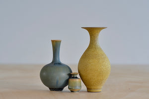 
            
                Load image into Gallery viewer, Miniature Hand Thrown Ceramic Vase Trio in Ochre and Green Blue by Yuta Segawa on white background.
            
        