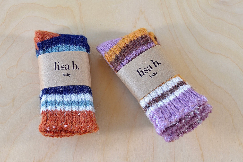 Lisa B baby socks in wool cashmere. Pumpkin or lilac. They don't fall off.
