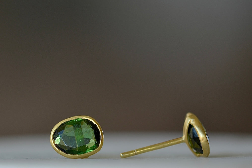 Side view of A new and smaller version of Pippa Small Classic Stud studs earrings in green tourmaline and 18k yellow gold.