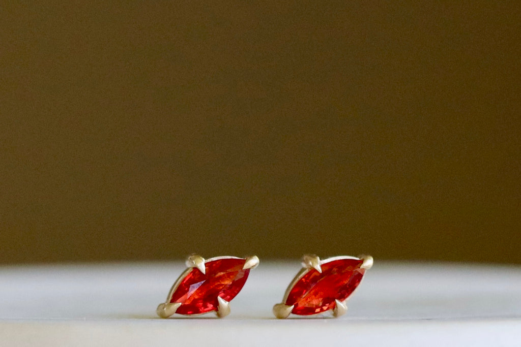 Alternate angle of Prong Set Marquise Sapphire Studs in 14k gold and orange by Elizabeth Street Jewelry.
