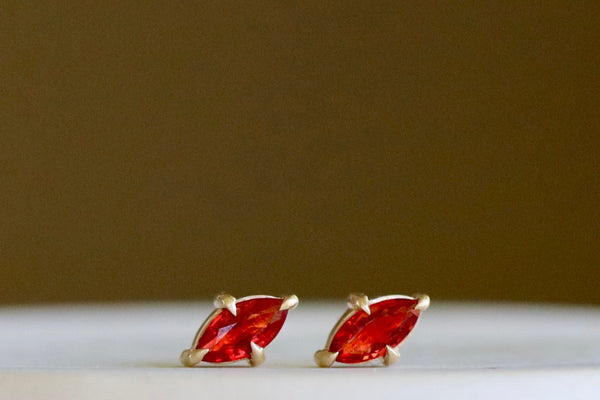 Alternate angle of Prong Set Marquise Sapphire Studs in 14k gold and orange by Elizabeth Street Jewelry.