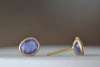 Side view of the new and smaller version of Pippa Small Classic Stud studs earrings in Tanzanite and 18k yellow gold.