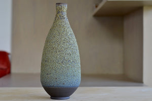 Alternate side of Heather Rosenman Tall Green Vase in Volcanic glaze.
