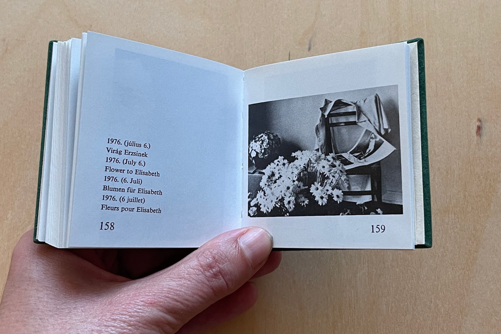 
            
                Load image into Gallery viewer, Image from A rare and out of print Andre Kertesz miniature photo book bound in green velvet with gilt lettering that was published by  Szentendre in 1987 with text in Hungarian, German, English and French.
            
        
