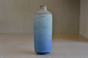 Other side of Heather Rosenman Tall Blue and gray flask vase in volcanic glaze.