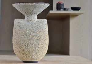 
            
                Load image into Gallery viewer, Alternate side of Hand thrown tall stoneware vase in Artemis shape with volcanic lava glaze in tan by Heather Rosenman Ceramics.
            
        
