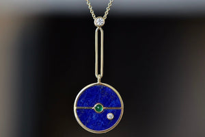 Close up of Compass Pendant Necklace in Lapis and Emerald by Retrouvai. Made in LA.