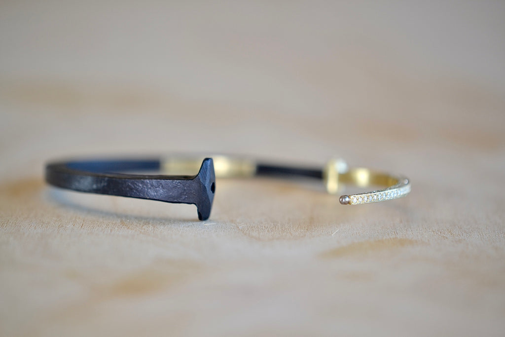 Pat Flynn Nail bracelet with pavé tail shown open.