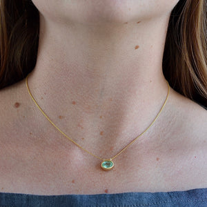 Wearing the Duo Bale Oval Emerald Necklace by Elizabeth Street Jewelry.