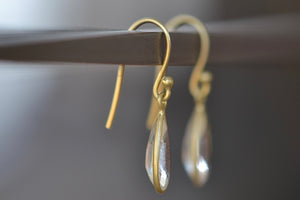 Side view of Inverted Crystal Drop Earrings designed by Tej Kothari are Small, faceted and inverted crystal drops on ear wire form these one of a kind light weight earrings for everyday use..