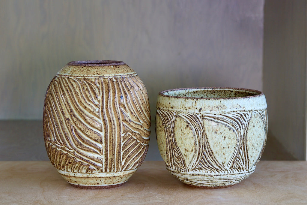 A one of a kind hand carved Irving Place Studio (IPS) Vase made by Dora De Larios (1933-2018). We have two of these and one is signed.