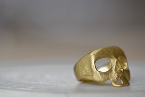 Side view of Mini Snaggle Tooth Skull ring by Polly Wales with baguette diamond snaggle tooth.