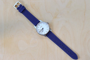 
            
                Load image into Gallery viewer, Full view of Weiss Watch 42mm Standard Issue Field Watch with White Dial and blue canvas strap is manually wound, made with American parts, featuring Super Luminova hands and markers.
            
        
