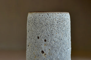 Detail of Gray to white cylinder ceramic vase by Heather Rosenman.