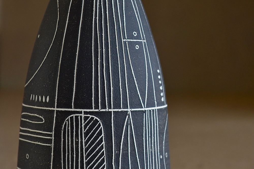 
            
                Load image into Gallery viewer, Detail of Heather Rosenman &amp;quot;Scribe&amp;quot; vase in brown with white sgraffito patterns is a hand thrown stoneware vase by Heather Rosenman.
            
        