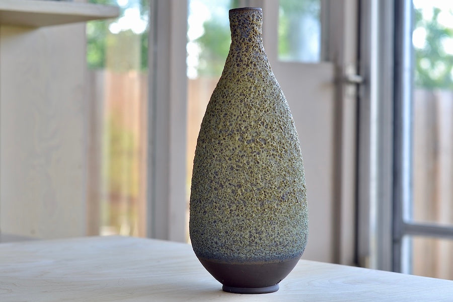 
            
                Load image into Gallery viewer, Heather Rosenman Tall Green Vase in Volcanic glaze. in different light.
            
        