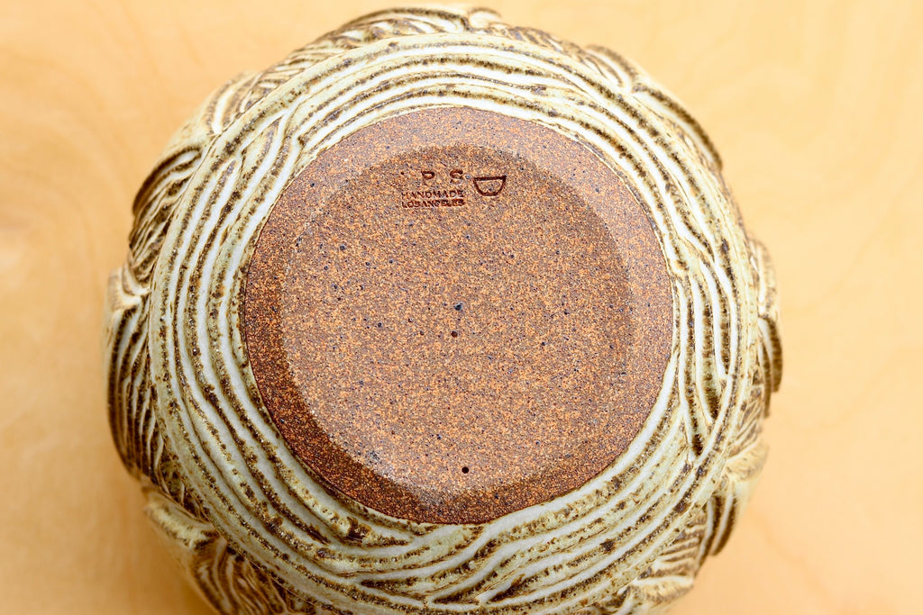 Bottom of ceramic pot or vase by Irving Place Studio and Dora de Larios.