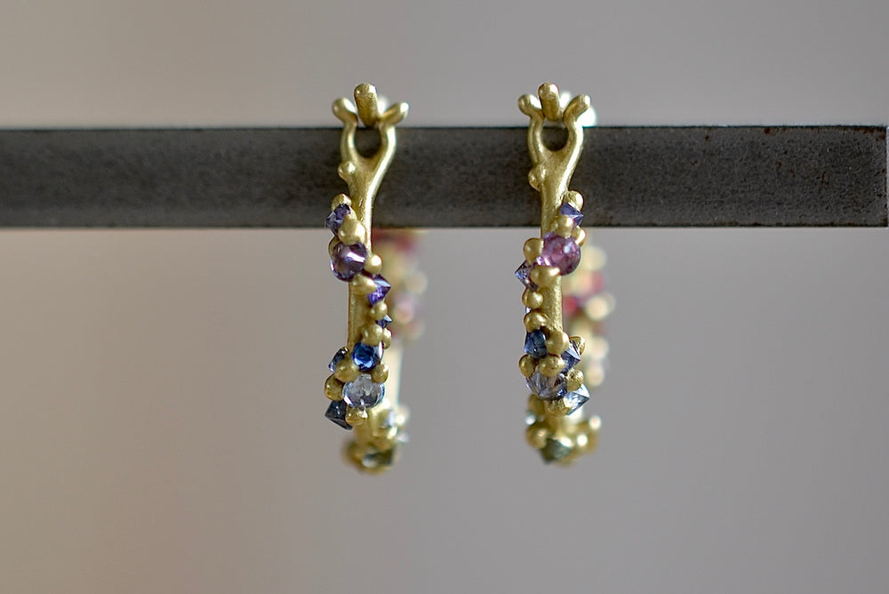 
            
                Load image into Gallery viewer, Polaris Vine Earrings in Rainbow Sapphires designed by Polly Wales seen from the back with an encrusted vine with inverted rainbow sapphires in purple, blue and green. Recycled Gold. Cast Not set. Handmade in Los Angeles.
            
        