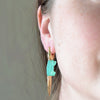 Wearing the chrysoprase Alligator Bite earring by Bibi Van Der Velden.