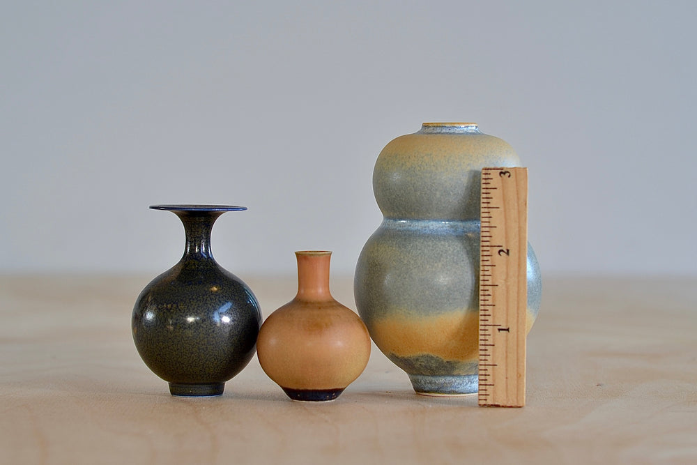 Miniature Hand Thrown Ceramic Vase Trio in Gray Blue with orange, Ochre and Dark Brown with ruler for scale by Yuta Segawa.