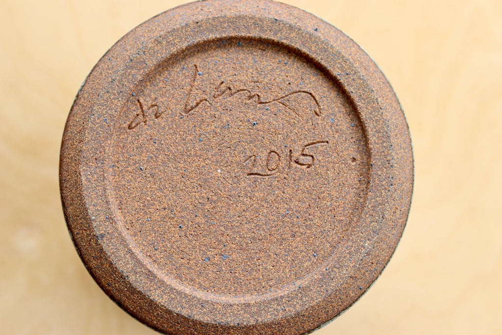 Dora de Larios signature on gray blue vase with triangles made in 2015.