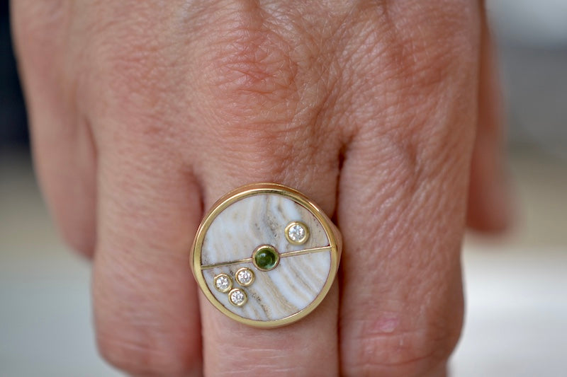 Wearing the Retrouvai Champagne Agate Compass Signet ring with Diamonds and green tourmaline in 14k yellow gold inlay.