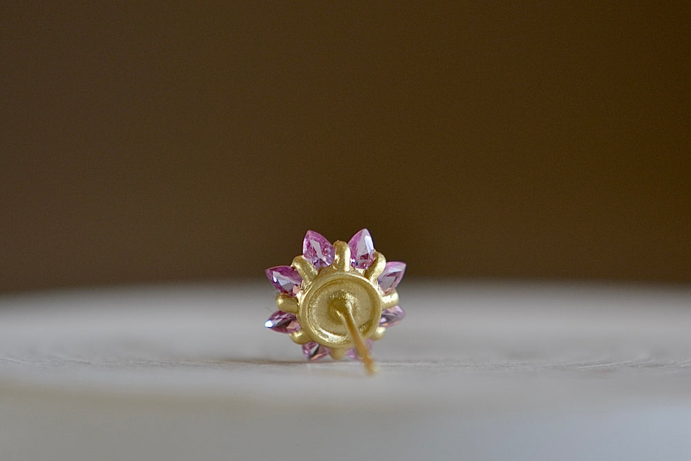 Back of green and pink Daisy stud earring by Polly Wales.
