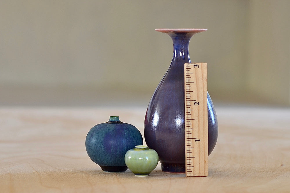 
            
                Load image into Gallery viewer, Miniature Hand Thrown Ceramic Vase Trio in Purple, turquoise and green by Yuta Segawa shown next to a ruler.
            
        