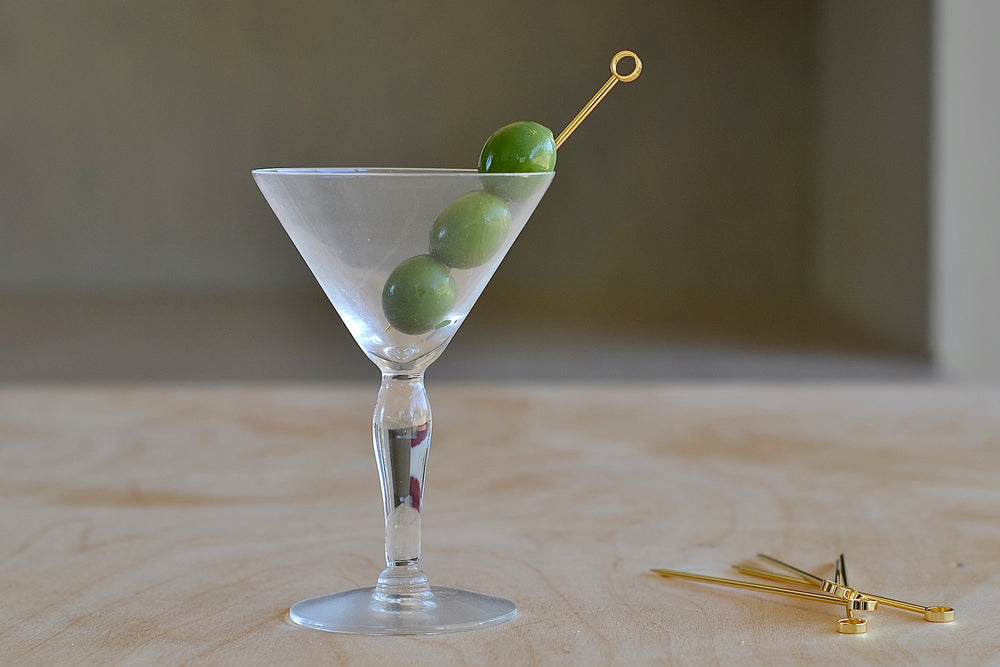 Cocktail pick in a Martini glass.