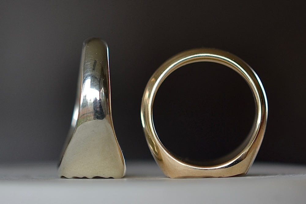 White and yellow gold Tidal square signet rings by Fraser Hamilton.