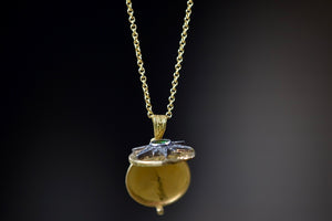 Showing the Star Locket with Green Emerald open.