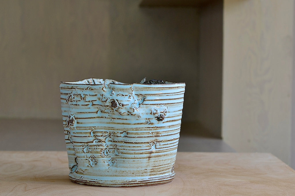 Other side of Hyejeong Kim Torn Vase #16 in blue celadon.