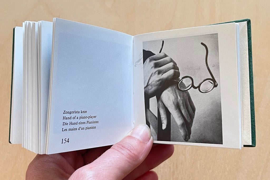 Image from A rare and out of print Andre Kertesz miniature photo book bound in green velvet with gilt lettering that was published by  Szentendre in 1987 with text in Hungarian, German, English and French.