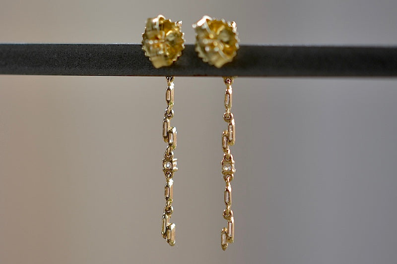 Looking at the Linear Drop Earrings designed by Suzanne Kalan from the back.