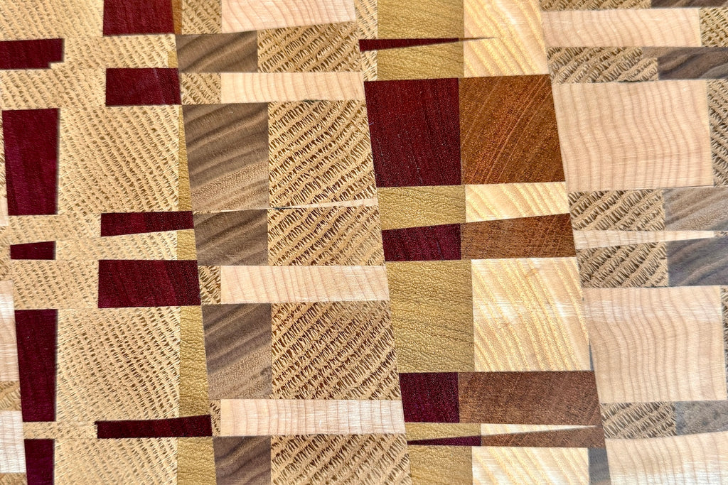 Close up on wood blocls on cutting board.