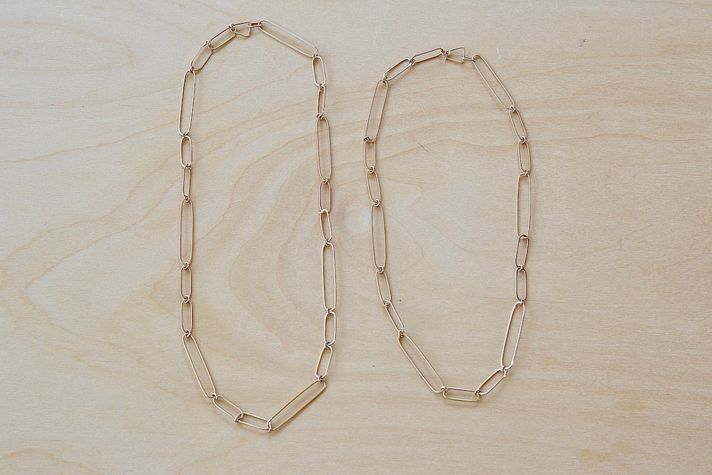 Long and short 14k gold paperclip chains (necklaces) with two short, one long flat clips in 15 or 17 inches by Kaylin Hertel.