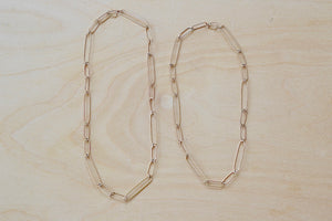 Long and short 14k gold paperclip chains (necklaces) with two short, one long flat clips in 15 or 17 inches by Kaylin Hertel.