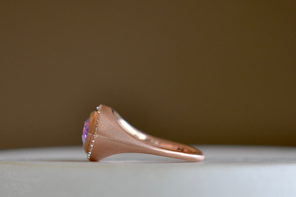 Side view of Sapphire Pear cut ring with Halo by Elizabeth Street Jewelry